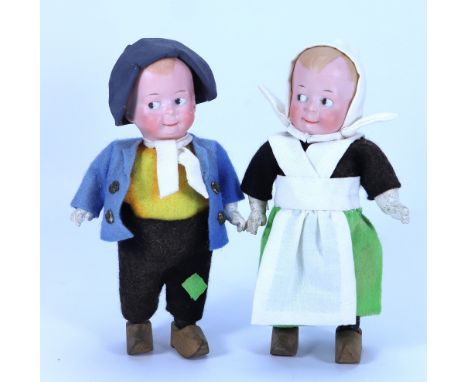 A pair of Ernst Heubach ‘Googly-eyed’ dolls in Dutch style costumes, German circa 1915, each with painted side glancing eyes,