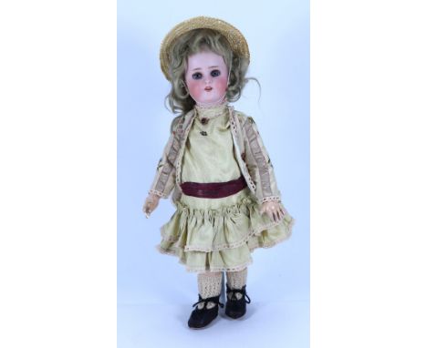 A Simon & Halbig 1078/Roullet & Decamps mechanical ‘walking’ bisque head doll, German, circa 1910, with fixed blue glass eyes