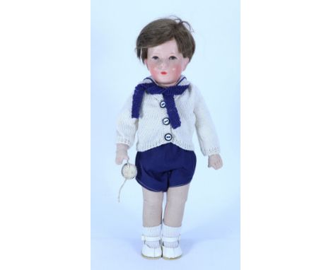 A Kathe Kruse cloth Doll IX ‘The little German child’, German circa 1930, the moulded head with painted face and short brown 