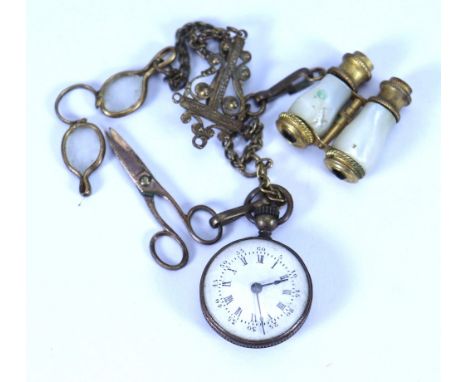 A French fashion dolls Chatelaine, circa 1870, the gilt chain with decorative clip, and mother of pearl binoculars, fob watch