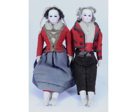 A pair of Francoise Gauthier bisque shoulder head fashion dolls in original clothes, French circa 1870, both with lovely pale