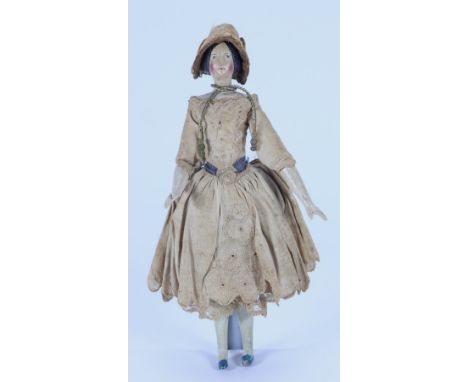 A Papier-mache shoulder head doll on wooden body and in original clothes, German circa 1830, with finely painted features and