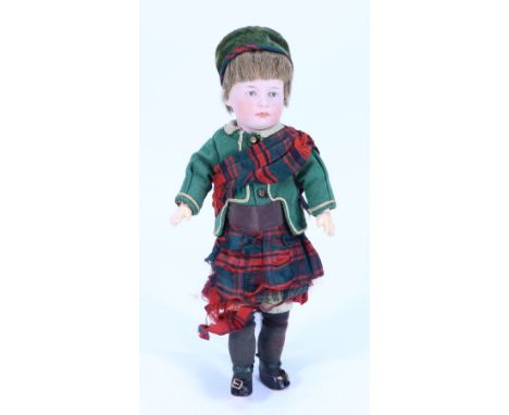 Gebruder Heubach character bisque head doll in original Scottish clothes, German circa 1910, with painted blue intaglio eyes,