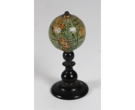 Miniature Dolls House globe on stand, 1880s, the printed world globe on turned wooden base, 2 ¼” (5.5cm), (condition: excelle