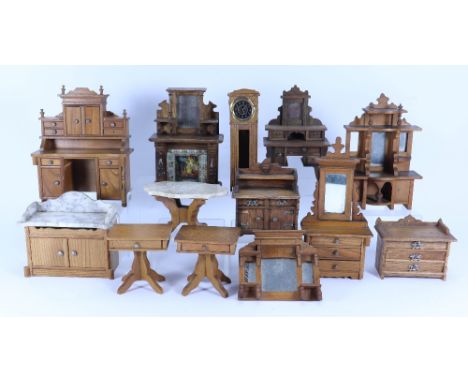 A collection of Schneegas wooden dolls house furniture, German 1900s, including sideboard with cupboards and drawers, 7 ¼” (1