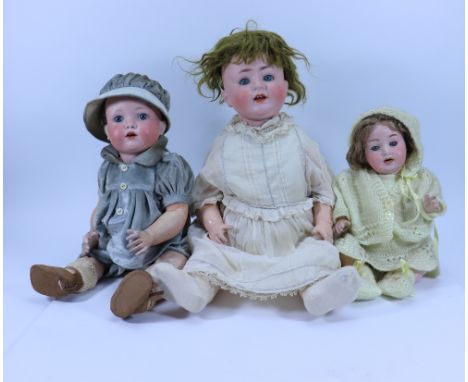 A.M ‘Melitta’ bisque head baby doll, German circa 1915, with weighted blue glass eyes, open mouth, two upper teeth, brown wig