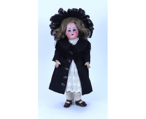 A sweet small Kammer & Reinhardt/S&H bisque head doll, German circa 1910, with weighted blue glass eyes, painted lashes and b