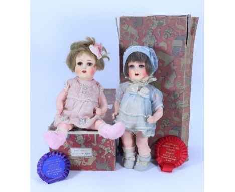 A pair of all original boxed A.M 996 sprayed bisque head dolls, German 1930s, both with weighted glass eyes, real lashes, sha