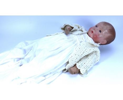 A rare Kathe Kruse ‘Du Mein’ sand baby doll VIw, German circa 1925, the life size new born baby doll with moulded muslin head