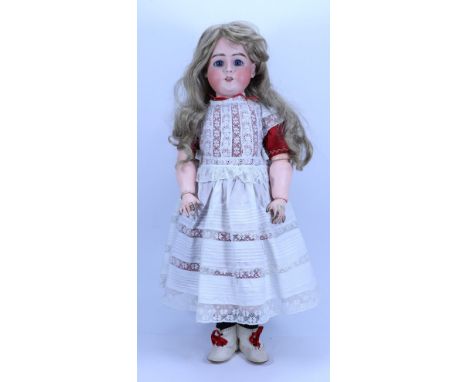 A large DEP bisque head doll, German circa 1910, with weighted blue glass eyes, painted lashes and brows, open mouth, upper t