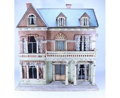 An impressive Christian Hacker painted wooden Dolls House, German 1890s, the exterior with printed red and white brick effect