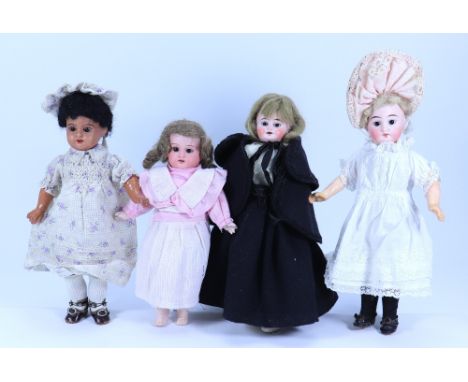 Four small bisque head girl dolls, German, circa 1915, including A.M 390 on a jointed wood and composition body, wearing a pi