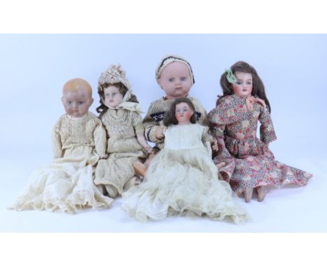 Four English bisque head dolls, 1920s-30s, including a baby with painted features, on a five piece composition body and weari