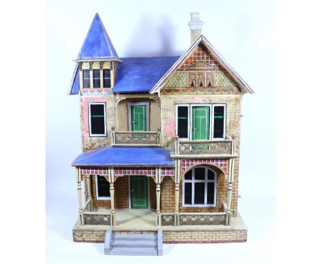 A large Moritz Gottschalk blue roof dolls house and contents, German circa 1900, the wooden dolls house with paper brick effe