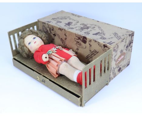 A rare Chad Valley  Mabel Lucy Attwell cloth doll in  original box/bed, English 1920s, the felt face with blue glass eyes, pa