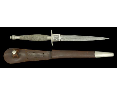 Fighting Knife. A Second War first pattern Fairburn-Sykes Commando fighting knife, complete with original brown leather scabb