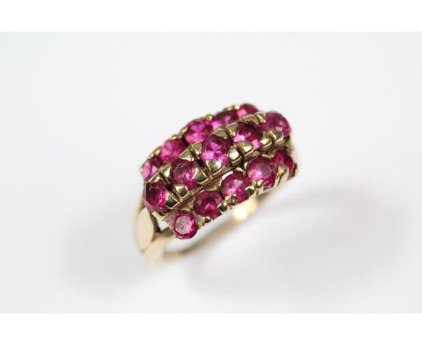 9ct gold ruby ring, size N+, set with fifteen 3.5mm rubies, approx 5.5 gms.Condition for this Lot - Sale 06/05/2020One side s