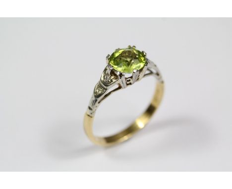 Vintage 18ct yellow gold peridot and diamond ring, the peridot approx 7mm set with approx 2pts of eight-cut dias, size K, app