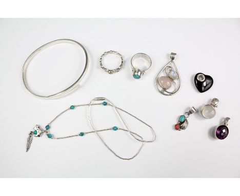 Sterling silver jewellery including a bangle stamped 925, silver and amethyst pendant, turquoise ring, moonstone pendants, tu