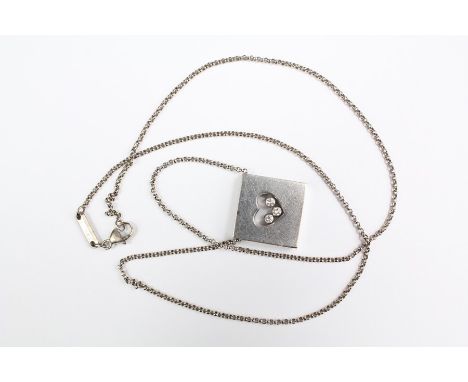 An 18k white gold Chopard 'Happy Diamonds' pendant suspended from the original chain, the pendant is approx 15 x 15 mm, the c