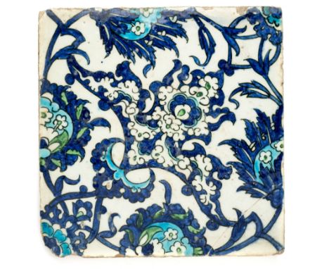 A DAMASCUS TILE, OTTOMAN SYRIA, LATE 16TH CENTURY Underglaze painted fritware, the design comprising an elaborate diagonally 