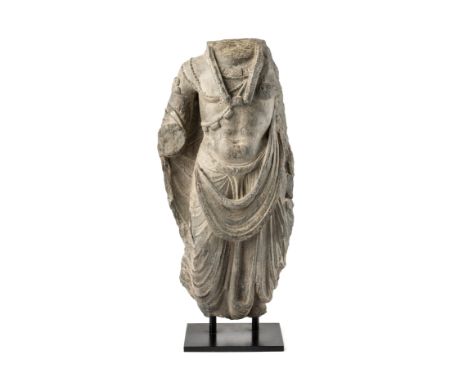A GANDHARA GREY SCHIST TORSO PROBABLY OF MAITREYA, NORTH-WESTERN PAKISTAN, 2ND/3RD CENTURY the naturalistically carved figure
