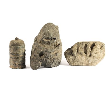 THREE GANDHARA GREY SCHIST FRAGMENTS, NORTH-WESTERN PAKISTAN, 3RD/4TH CENTURY comprising a Buddhist reliquary in the form of 