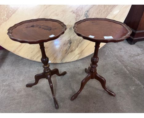 A pair of mahogany tripod wine tables 