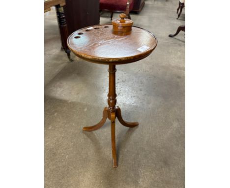A Victorian style oak tripod smoking table 