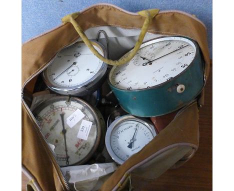 A collection of dials, including pressure guages, scales, etc. 