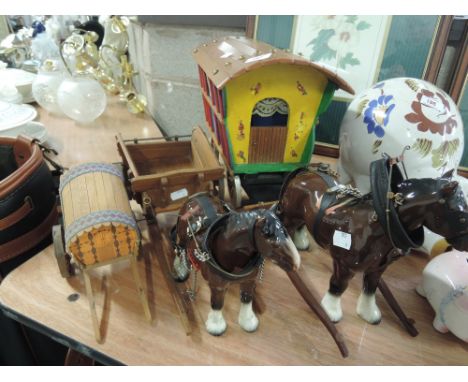 A treen Gypsy caravan and cart with ceramic horses in harness