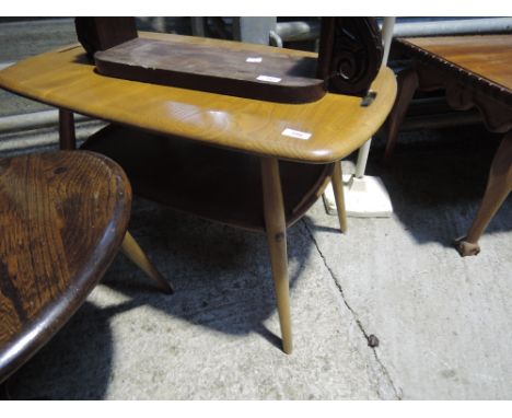 An Ercol medium colour coffee table having undertier shelf