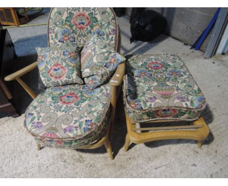 An Ercol light colour spindle back  armchair and footstool