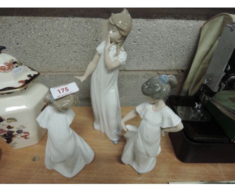 Three Nao figurines including 1109, 1110