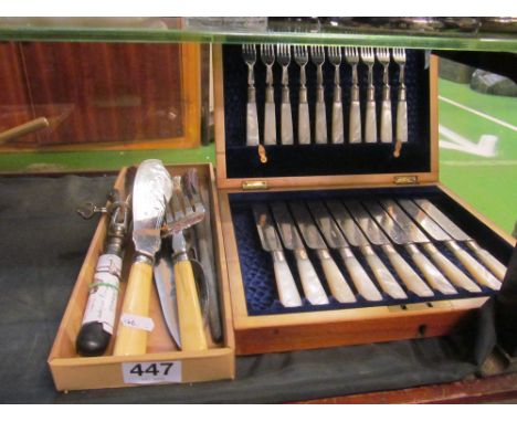 A set of ten mother of pearl handle dessert knives and forks (i.c), silver-plated fish servers, horn handled carving set and 