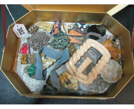 A selection of vintage buckles in vintage chocolate box