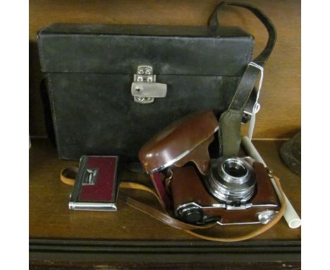 A Bell and Howell optonic eye cine camera (i.c), a Kodak Retinette camera and a pair of Crystar lens opera glasses