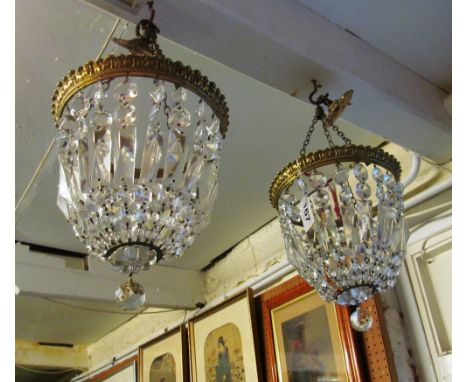 A pair of basket form lustre light fitting with brass rim