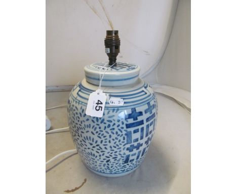 A Chinese rice pattern blue and white table lamp