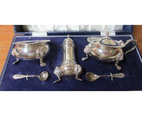A silver three piece condiment set blue glass liners (i.c) 14.6 ozs