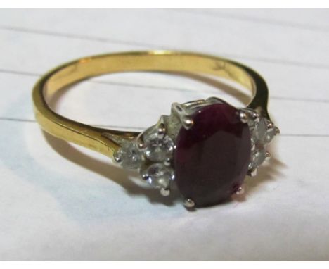 A ruby and diamond ring marked 750 3.2gms