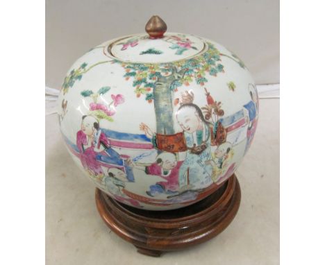 A 19th Century Chinese famille rose lidded spherical pot decorated figures playing with children in interior setting seal mar