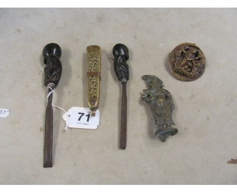 A pair of African tools with carved monkey handles and three items islamic brass