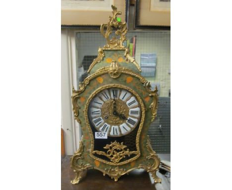 A green lacquered ornate clock with floral design and gilt mounts with matching wall bracket