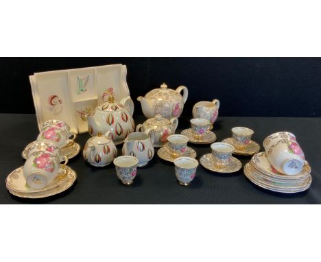 A Sadler gilt and crinoline lady tea service for six; a similar continental coffee set for six; a Poole h'orderves dish (qty)