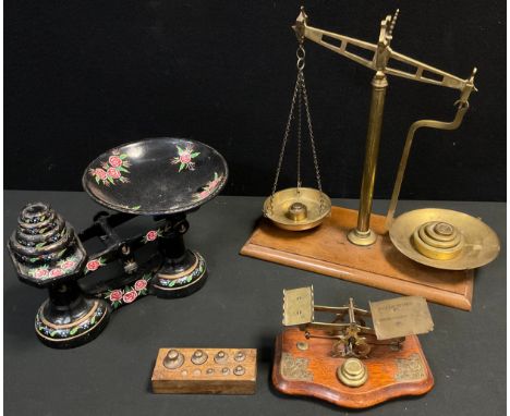 A set of Victorian Postage scales, brass mechanism, serpentine oak base;  a set of painted Avery scales, four graduated weigh