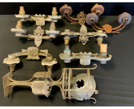 A wrought iron/metal light fitting;  others rise and fall etc 