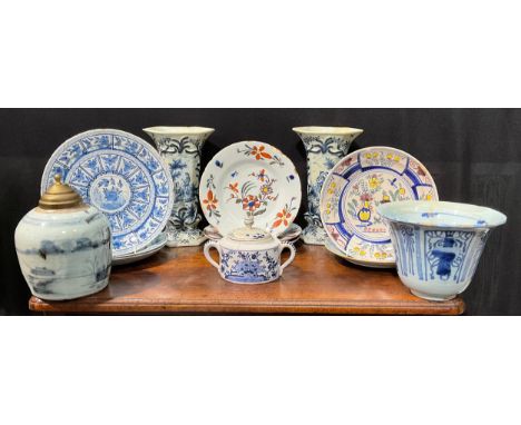 A collection of Delftware including plates, a pair of vases, etc 