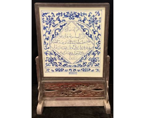 A contemporary Chinese blue and white ceramic table screen, carved hardwood frame and stand, 78cm high 