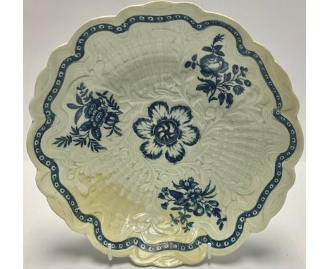 An 18th century Worcester basket weave shaped circular bowl, painted in underglaze blue with flowers, 23.5cm diameter, cresce